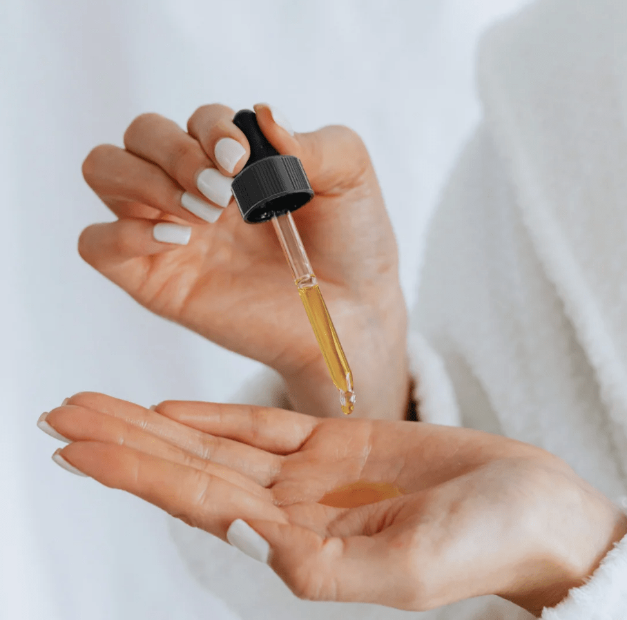 Forceup 100% Natural Soursop Oil in a clear bottle with a green label, surrounded by fresh soursop fruit.